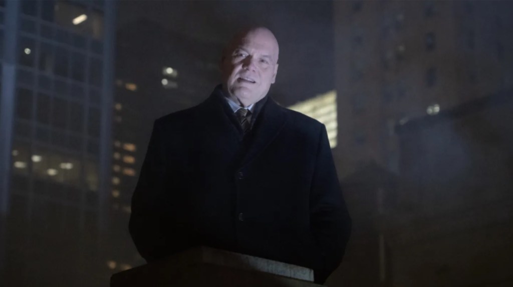 A stern Wilson Fisk (Vincent D'Onofrio) wearing a white suit in a dark, atmospheric scene from Daredevil: Born Again.