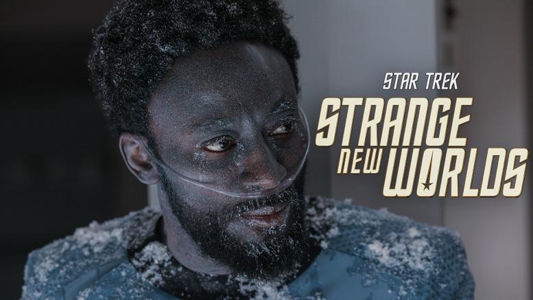 Dr. M’Benga covered in frost and debris with an oxygen cannula in a tense moment from Star Trek: Strange New Worlds, featuring the show's title logo on the right.