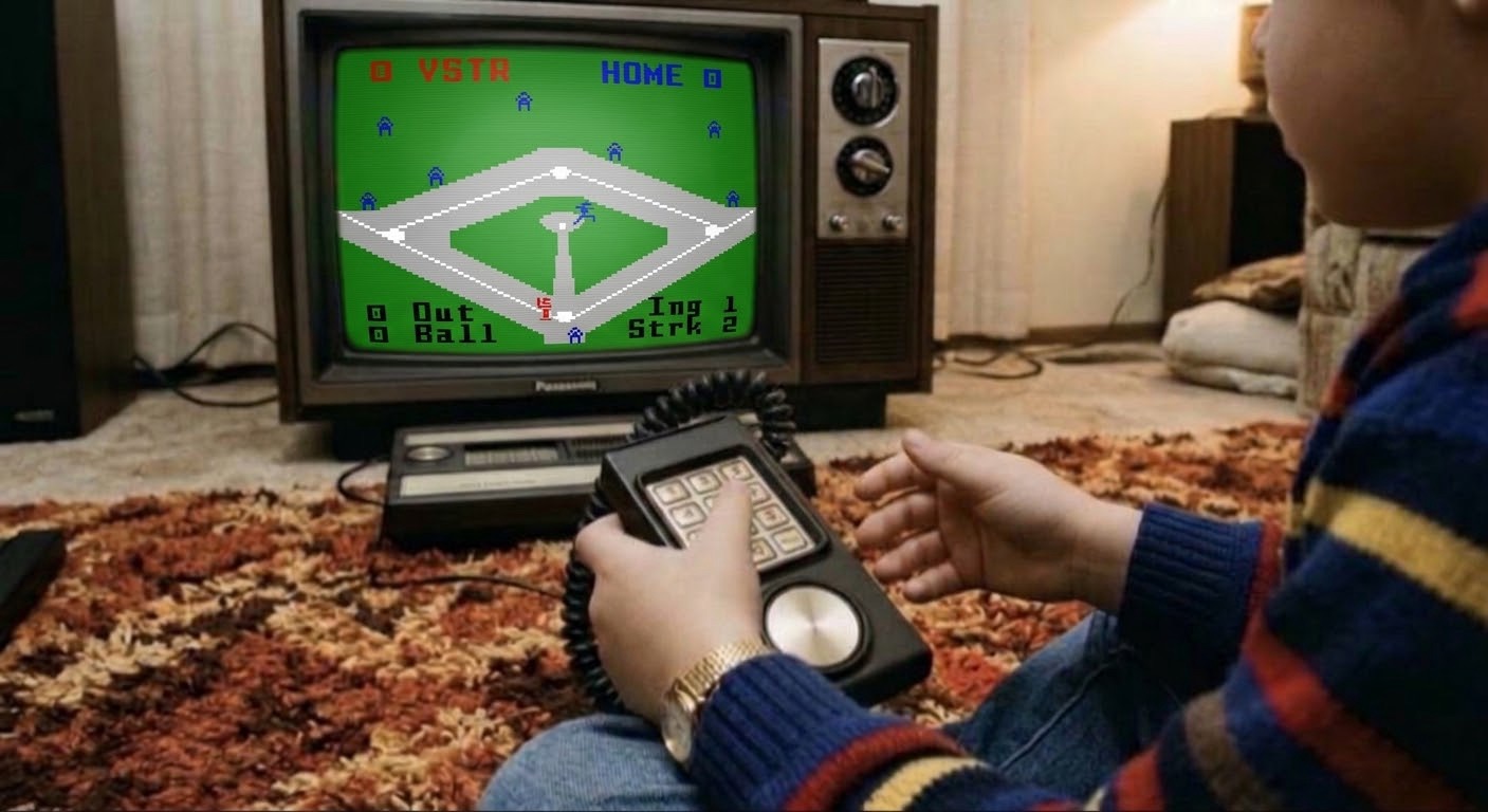 A young boy in a striped sweater sitting on a shag rug, holding an Intellivision keypad controller while playing authentic Intellivision Major League Baseball on a vintage wood-grain CRT television set.